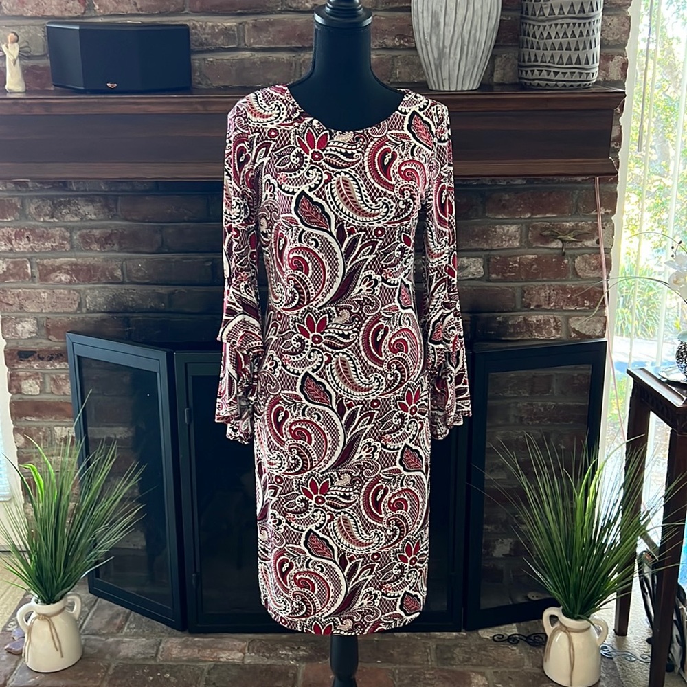 Gorgeous dress with bell ruffled sleeve.